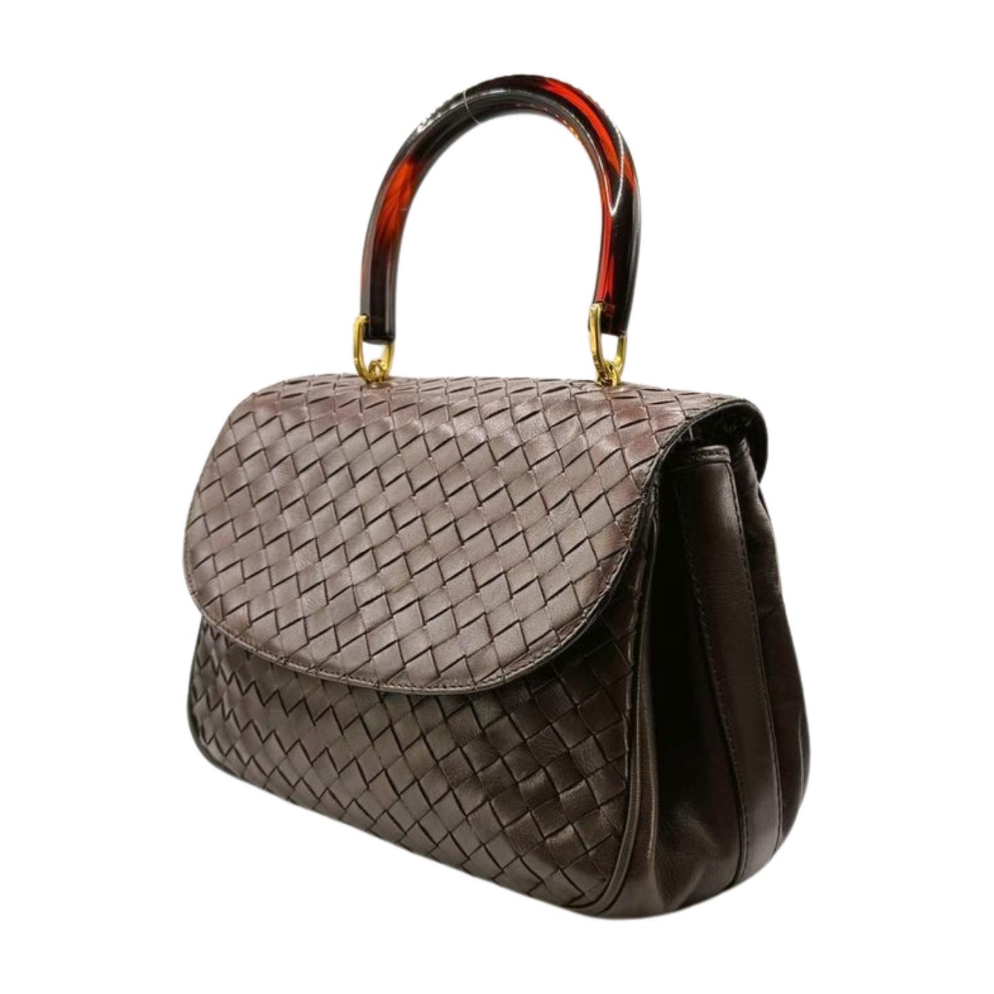 A stylish Bottega Veneta Intrecciato Top Handle Bag with a woven Intrecciato pattern in dark brown fabric and smooth lambskin leather sides. It features a top handle made of transparent amber-like material attached with gold-tone hardware. The bag has a flap closure, embodying the refined elegance typical of Bottega Veneta.