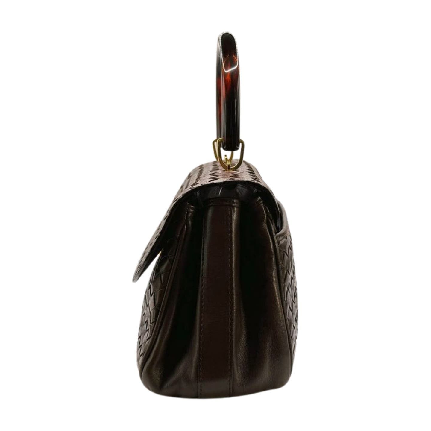 Side view of a dark brown Bottega Veneta Intrecciato Top Handle Bag featuring an Intrecciato woven pattern on the sides and a semi-circular handle in a tortoiseshell design. The lambskin leather bag is closed at the top with a flap.