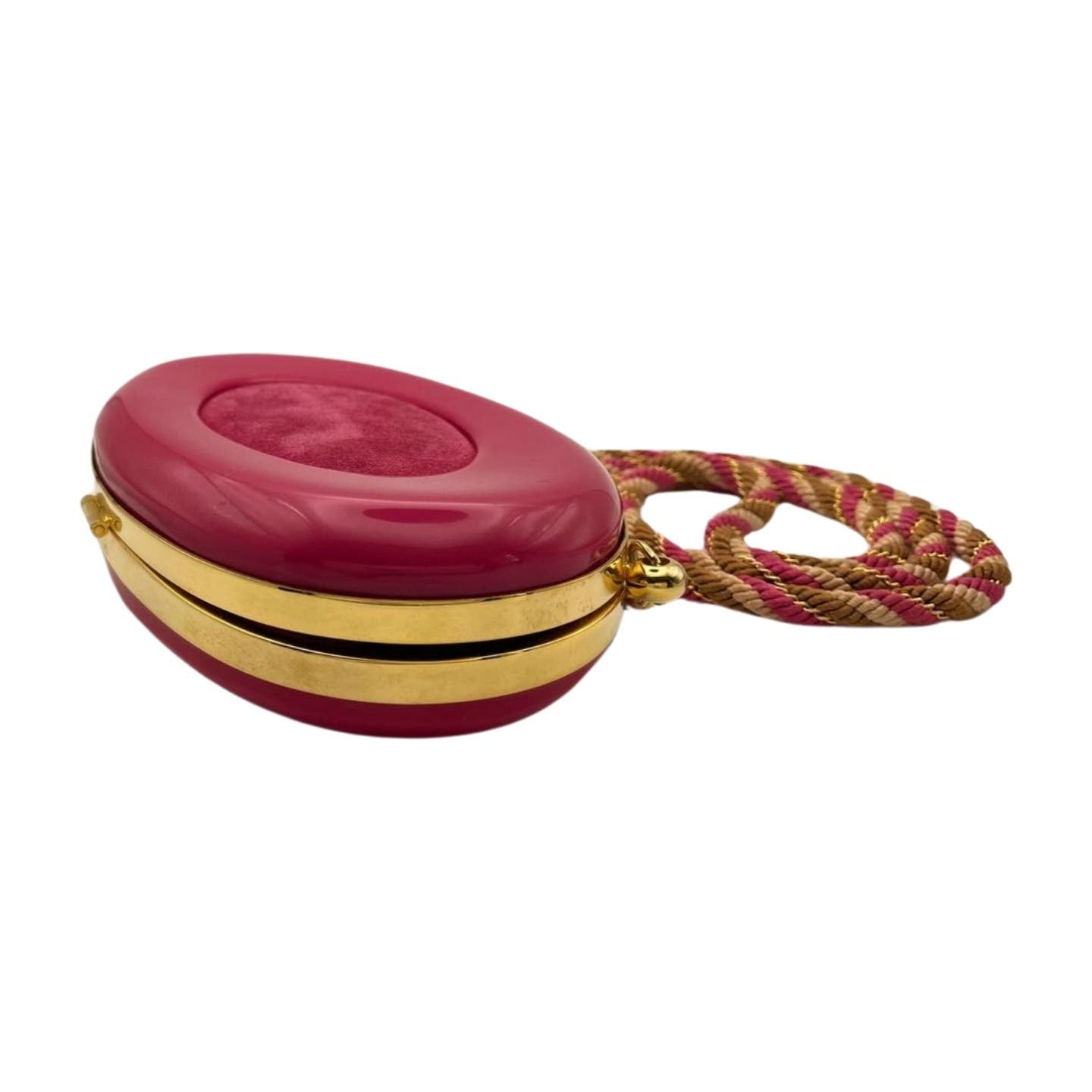 A small, oval-shaped pink handbag with a shiny gold trim, featuring a gold latch and a pink-and-brown braided strap. The handbag boasts an elegant appearance with its smooth, glossy surface and vintage Celine Hard Shell Bag feel. Inside, it has a luxurious leather interior from Celine.